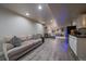 Wide angle view of finished basement featuring a bar, lounge seating, and modern flooring, ideal for recreation at 10701 Flagler Dr, Parker, CO 80134