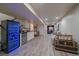 Basement area includes a wine fridge, wet bar, and seating area, perfect for entertaining guests in style at 10701 Flagler Dr, Parker, CO 80134