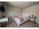 Cozy bedroom featuring carpeted floors, a white bed frame, and a minimalist decor at 10701 Flagler Dr, Parker, CO 80134
