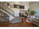 Elegant foyer with hardwood floors, staircase, and high ceilings leading into the living area at 10701 Flagler Dr, Parker, CO 80134