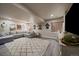 Finished basement with a comfortable sectional sofa, large rug, and a rustic-themed decor at 10701 Flagler Dr, Parker, CO 80134