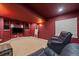 Cozy media room with comfortable seating, built-in shelving, and a large television for entertainment at 10701 Flagler Dr, Parker, CO 80134