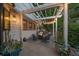 Cozy outdoor patio with a pergola, string lights, and comfortable seating around a fire pit at 10701 Flagler Dr, Parker, CO 80134
