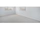 Bright bedroom featuring neutral carpet, natural light, and spacious design at 2203 S Holly St # 3, Denver, CO 80222