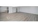 Bright living room featuring gray wood flooring with modern design at 2203 S Holly St # 3, Denver, CO 80222