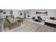 Open-concept living and dining area featuring modern decor and stylish gray wood flooring at 2203 S Holly St # 3, Denver, CO 80222