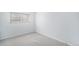 Spacious room with neutral carpet and plenty of natural light from the window at 2203 S Holly St # 3, Denver, CO 80222