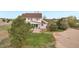 Backyard with patio, fire pit, grassy area and privacy landscaping at 28700 E 160Th Pl, Brighton, CO 80603