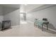 Finished basement with a work space, exercise equipment, and neutral carpet at 28700 E 160Th Pl, Brighton, CO 80603