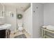 Charming bathroom with a wreath, shower, and vintage-inspired vanity at 28700 E 160Th Pl, Brighton, CO 80603