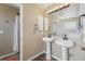 En-suite bathroom featuring double sinks and modern lighting with private toilet and shower at 28700 E 160Th Pl, Brighton, CO 80603