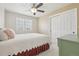 Sunny bedroom with plush carpet, large closet and big window looking outside at 28700 E 160Th Pl, Brighton, CO 80603