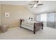 Comfortable bedroom featuring vaulted ceiling and large windows with stylish curtains at 28700 E 160Th Pl, Brighton, CO 80603