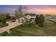 Beautiful two-story home with a three car garage, lush lawn and a large front yard at 28700 E 160Th Pl, Brighton, CO 80603