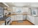 Charming kitchen featuring wood countertops, stainless steel appliances, and ample cabinet space at 28700 E 160Th Pl, Brighton, CO 80603