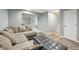 Spacious living room featuring a comfortable couch and access to stairs at 28700 E 160Th Pl, Brighton, CO 80603