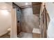 Modern bathroom featuring tiled shower with rainfall shower head and granite bench at 1149 S Kittredge St, Aurora, CO 80017