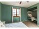 Bedroom showcases a window with natural light and a built-in bench, creating a peaceful ambiance at 1149 S Kittredge St, Aurora, CO 80017