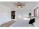 Bright bedroom includes walk-in closet, white walls, neutral tones and ceiling fan at 1149 S Kittredge St, Aurora, CO 80017