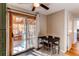 Dining area with tiled floor, table, and sliding doors that let in natural light at 1149 S Kittredge St, Aurora, CO 80017