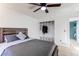 Main bedroom featuring a ceiling fan and closet with shelves and drawers, offering convenient storage at 1149 S Kittredge St, Aurora, CO 80017