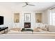 Bright living room with fireplace and built-in shelving at 15525 E Orchard Pl, Centennial, CO 80016