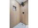 Shower featuring stone flooring and a black rainfall shower head at 3460 S Eudora St, Denver, CO 80222