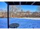 View of backyard and snow-covered ground with a small table at 309 E Highline Cir # 103, Centennial, CO 80122