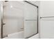 Clean bathroom with shower/tub combo and tiled walls at 309 E Highline Cir # 103, Centennial, CO 80122