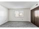 Simple bedroom with carpet, double closet, and window at 309 E Highline Cir # 103, Centennial, CO 80122