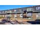 Rear view of the building, showing balconies and parking at 309 E Highline Cir # 103, Centennial, CO 80122