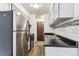 Kitchen with stainless steel appliances and gray cabinets at 309 E Highline Cir # 103, Centennial, CO 80122