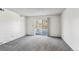 Living room with gray carpeting and sliding glass door at 309 E Highline Cir # 103, Centennial, CO 80122