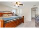 Bright bedroom with a wooden bed frame and ample closet space at 10273 E Peakview Ave # D202, Englewood, CO 80111