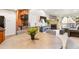 Open concept dining area with kitchen and living room views at 10273 E Peakview Ave # D202, Englewood, CO 80111