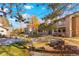Exterior view of condo building, showing landscaping and walkway at 10273 E Peakview Ave # D202, Englewood, CO 80111