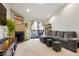 Spacious living room with fireplace and access to a balcony at 10273 E Peakview Ave # D202, Englewood, CO 80111
