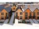 Modern townhomes showing a landscaped walkway to the front door and featuring contemporary wood and dark metal siding at 9171 Eaton St, Westminster, CO 80031
