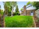 Expansive backyard showcasing a well-manicured lawn and mature trees, great for outdoor activities at 9765 W 77Th Dr, Arvada, CO 80005