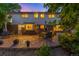 Enjoy gatherings on the stone patio, surrounded by lush landscaping and the home's brick exterior at 9765 W 77Th Dr, Arvada, CO 80005
