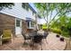 Charming backyard patio with stone pavers and outdoor seating, ideal for relaxation and outdoor dining at 9765 W 77Th Dr, Arvada, CO 80005