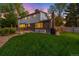 A well-manicured lawn complements this home's exterior and outdoor patio at 9765 W 77Th Dr, Arvada, CO 80005