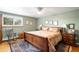 Comfortable bedroom with a ceiling fan, hardwood floors and natural light at 9765 W 77Th Dr, Arvada, CO 80005