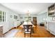 Spacious dining room with hardwood floors, neutral walls and views to the backyard at 9765 W 77Th Dr, Arvada, CO 80005