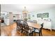 Bright and airy dining room with hardwood floors and stylish light fixture at 9765 W 77Th Dr, Arvada, CO 80005