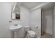 Basement bathroom featuring a pedestal sink, toilet and walk-in shower at 10092 Lee St, Broomfield, CO 80021