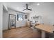 This bedroom has hardwood floors, a ceiling fan and a sunny window at 10092 Lee St, Broomfield, CO 80021