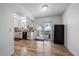 Spacious eat-in kitchen with white cabinets, stainless steel appliances, and sliding glass doors to the deck at 10092 Lee St, Broomfield, CO 80021