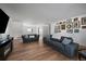 Bright living room featuring hardwood floors, comfortable seating, and a modern fireplace at 10092 Lee St, Broomfield, CO 80021