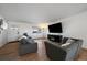 Bright living room featuring wood floors, recessed lighting, and comfortable seating at 10092 Lee St, Broomfield, CO 80021